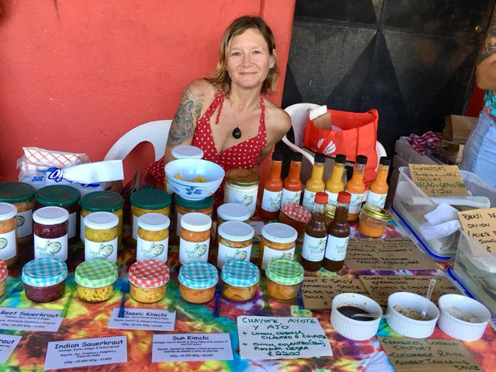 Me and my table full of my products at the farmers market in Puerto Viejo